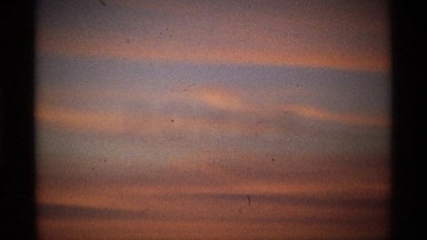 1974: a beautiful sunset with rolling clouds in the distance. WORLDS FAIR