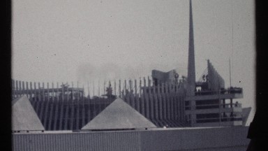 1967: A Peaceful Morning at Montreal's Riverside Entrance Gate with Boat and Dam