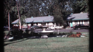 1967: a man is coming from his bungalow and a blue colour car is waiting for him