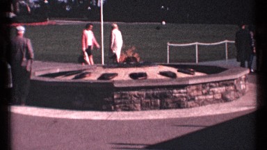 1967: people walking by a memorial which features an eternal flame. OTTAWA
