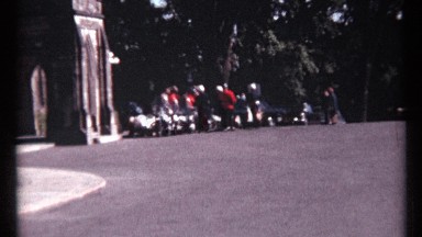 1967: an group of mounties are seen stationed outside of a building answering