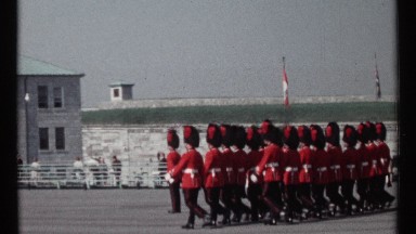 1967: Two Lines of Guards in Red Jackets, Black Trousers and Fur Caps March