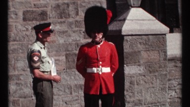 1967: a guard in modern uniform stand near a royal guard OTTAWA CANADA