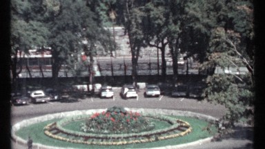 1967: circular garden of concentric rings has plants and flowers in center