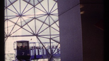 1967: a train trolley rounds a track with visitors on board MONTREAL CANADA