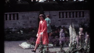 1967: women in dresses strolling in garden and observing flowers MONTREAL CANADA