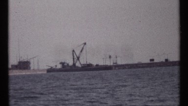 1967: ocean liners docked seaside wait with cranes in air for jobs MONTREAL