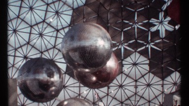 1967: dotted metallic spheres hang from structure made of hexagonal panels