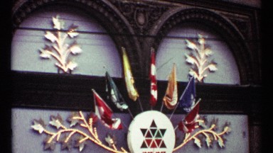 1967: large golden brass leaves hang over a storefront greeting visitors TORONTO