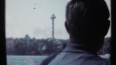 1967: a large pillar that located at the center of the plants and man looking