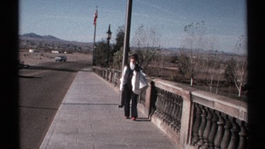 1972: Older Woman Walking Slowly Toward Camera in Arizona