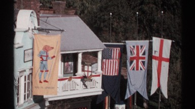 1972: country flags being displayed off the houses. we are showing u.s., u.k.,