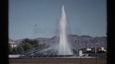 1972: fountain set against mountain background spewing water ARIZONA