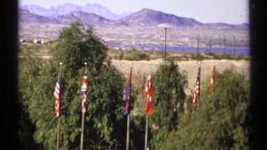 1972: this is a scenic view of an outdoor area with a mountain range in the