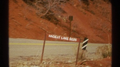1972: excavation site of an old ancient lake bed with dark red earthy soil
