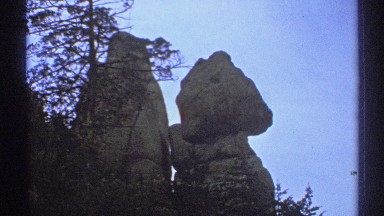 1972: a unique twin rock formation sits on top of a ridge covered with
