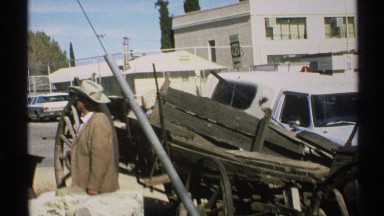 1972: man in cowboy hat with broken down wagon and white pickup truck ARIZONA