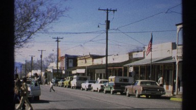 1972: several different people are going about their business on a busy street