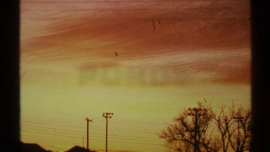 1972: view of the power lines with the sun setting in the background unleashing