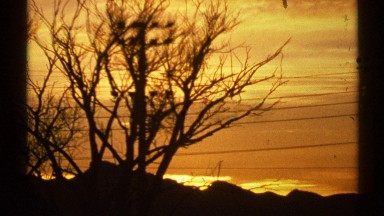1972: a bright, clear orange sunset is shown on a winter's day. ARIZONA