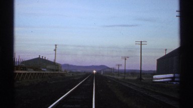 1972: a railway track and a train may be comes from a long distance or lamp only