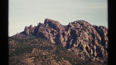 1972: a rock with full of hard and some grass also there at the morning sky also