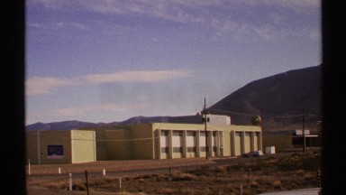 1972: a building that looks like building and located alone at the open ground