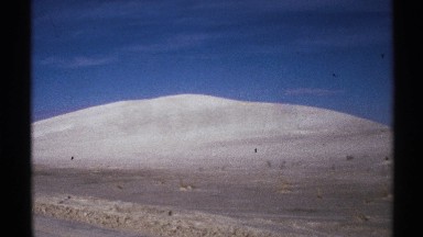 1972: snow covered hill looking up from the road NEW MEXICO