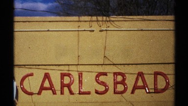 1972: seven letters are written on the wall or a big size board that located