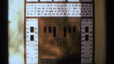 1972: view of a building with panes of glass and door handles NEW MEXICO