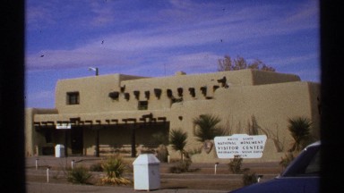 1972: a building alone with a board that contain letters but couldn't read what