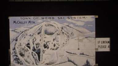 1971: webb ski system flyer leads to a beautiful field of green trees. NEW YORK