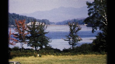 1971: lake scenery with majestic mountains and colorful foliage. NEW YORK