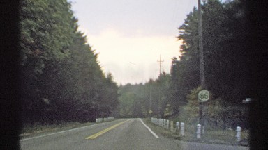 1971: enjoying to drive along a very quiet road surrounded by nature NEW YORK