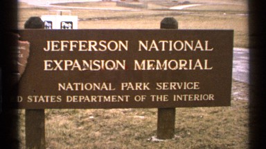 1972: a board stand at the ground that has two things like the name of nation