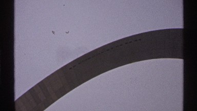 1972: An arch at the top with sky and clouds visible in a peaceful morning scene