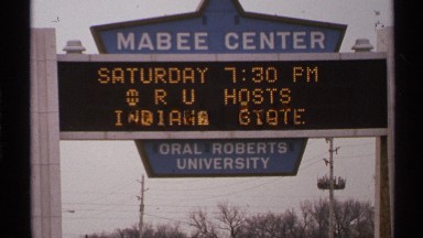 1972: blue geometric sign identifies mabee center of oral roberts university
