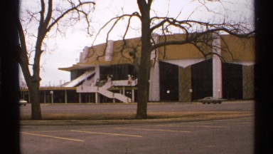 1972: a bungalow at the place and a road with more space in front of it some