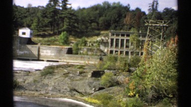 1971: view of rushing dam and spillway in the summer time MAINE