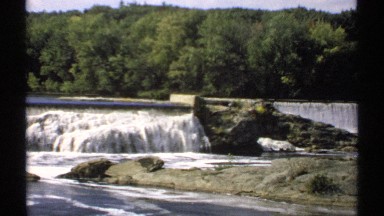 1971: beautiful landscape of a cascade in a river surrounding with trees. MAINE