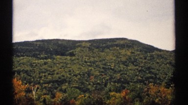 1971: green mountain changing colors in the season NEW HAMPSHIRE