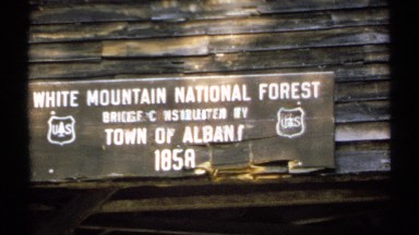 1971: a board that contain the name of the forest and it located at the wall and