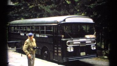 1971: a man come out from the bus and walking out from the place at out the