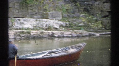 1971: a boat in water on a bright day outside NEW YORK