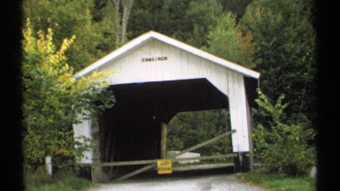 1971: covered bridge passageway boarded up with a road closed sign VERMONT