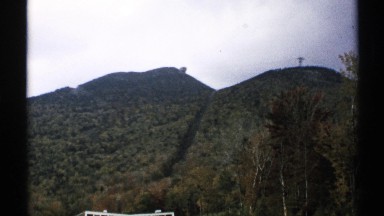 1971: a quiet mountainside that is steep and frames the video. VERMONT