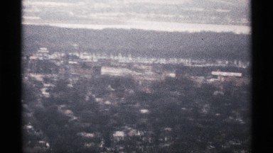 1971: a city long sight view more buildings and nature also looking so far and