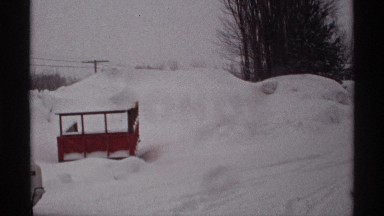 1971: a snow place and a vehicle located on the place and trees also available