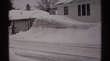 1971: Man Digging Snow by Hand Amidst Snowdrift in Wisconsin