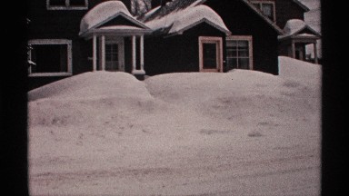 1971: roads and houses covered by snow on a cold winter day. WISCONSIN